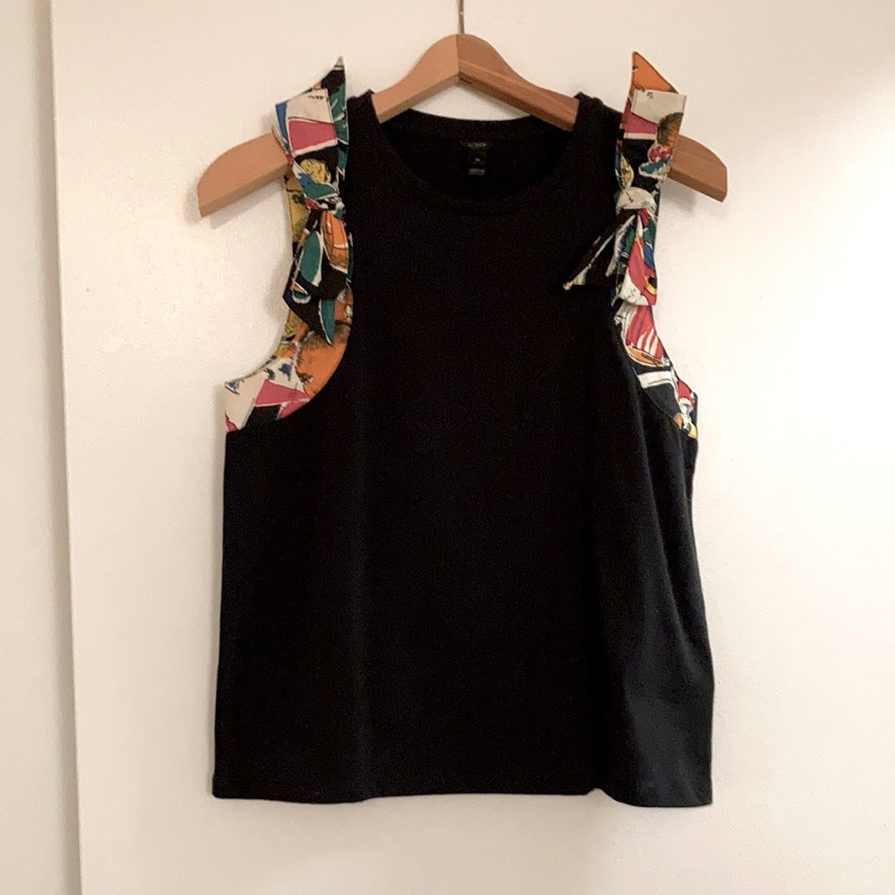 Sleeveless Black wool top with colorful shoulder detailing.